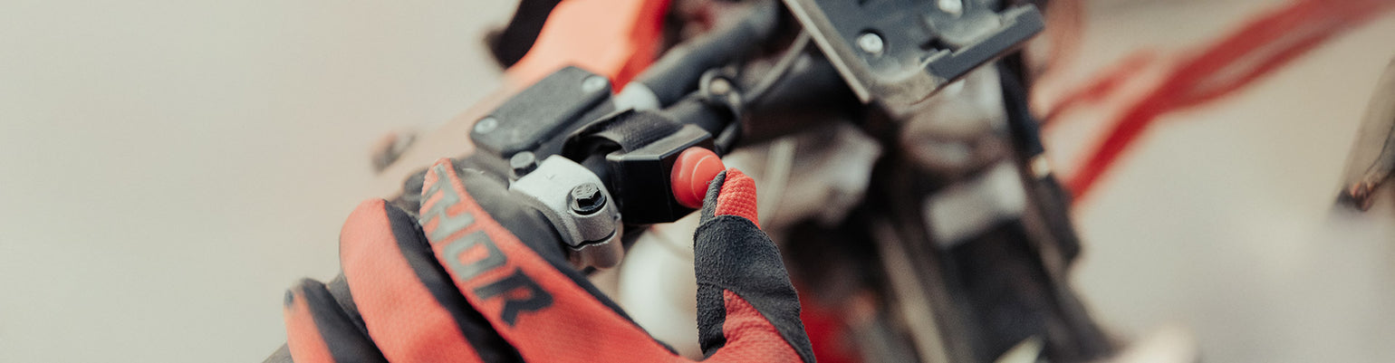 Push‑to‑Talk (PTT) buttons and accessories—handlebar PTTs for motorcycles, velcro or hole‑mount PTTs for cars and UTVs, rocker switch alternatives, quick‑disconnect PTTs, foot‑pedal hands‑free PTT, replacement buttons, and extension or adapter cables.