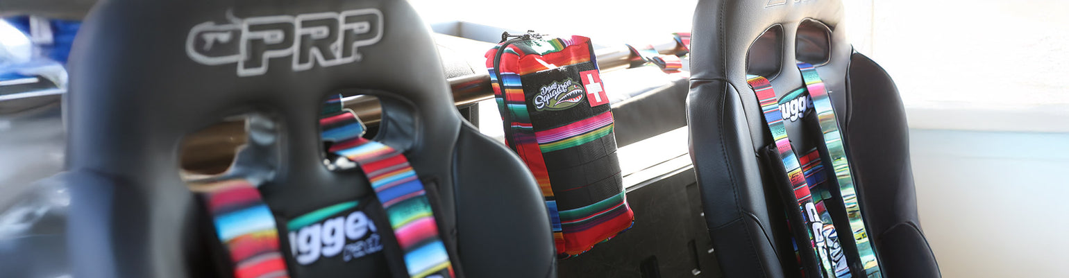 Race safety gear including neck restraints, first‑aid kits, and catheter supplies