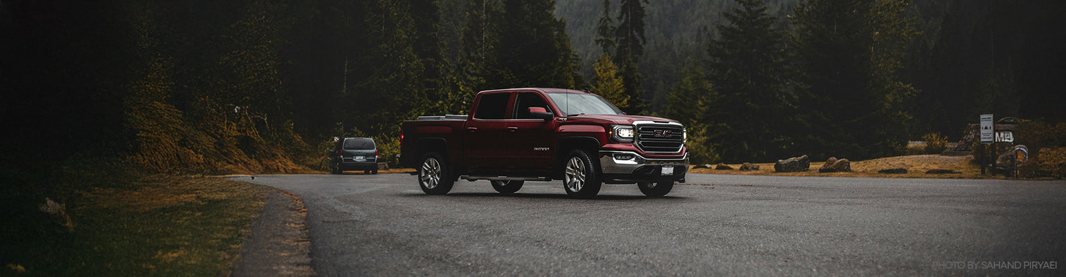 Rugged Radios Chevrolet / GMC two‑way radio communication kits and A‑pillar antenna mount with center‑console radio mounting bracket for direct‑fit install in Silverado, Sierra, ZR2, AT4X overland vehicles.